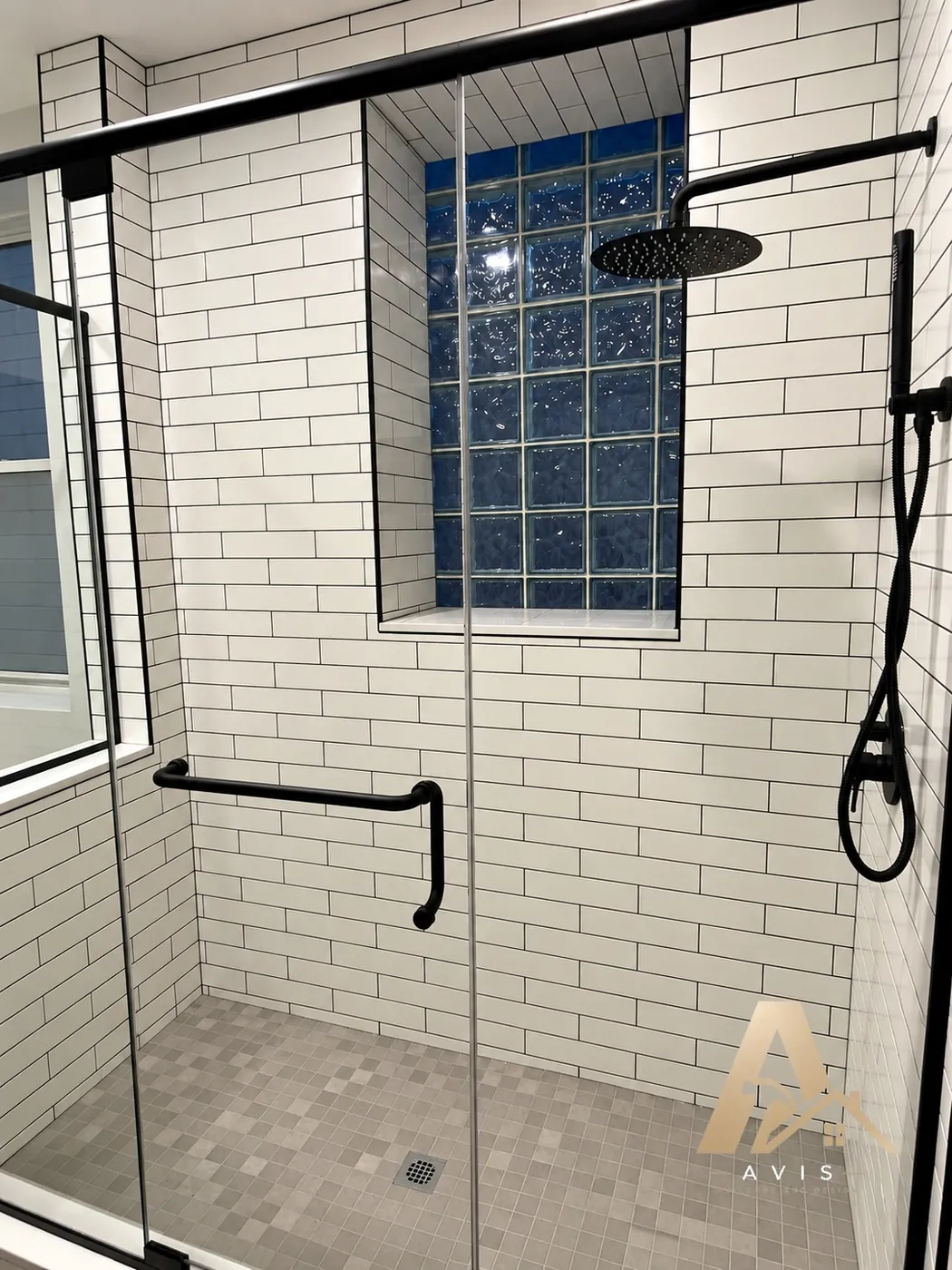 Shower behind a tiled pony wall with glass above