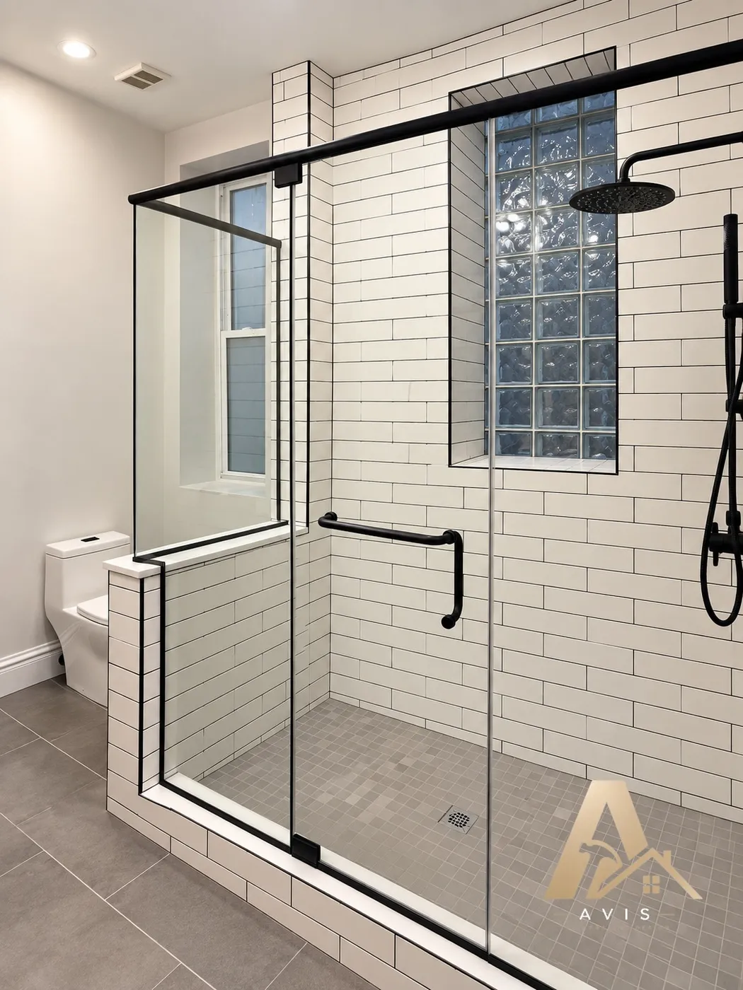Walk-in shower with white subway tile, a glass block window, and black-framed glass