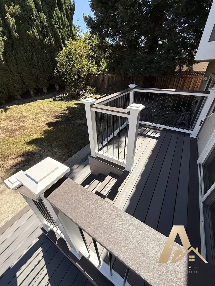 Composite deck with built-in bench seating and post cap lights