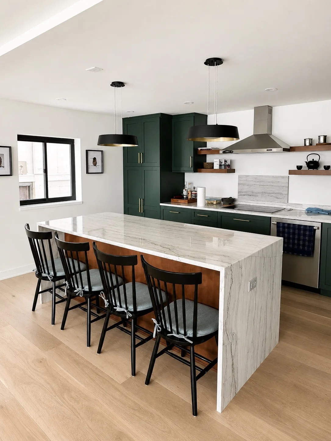 Dark green kitchen and marble island with seating for four
